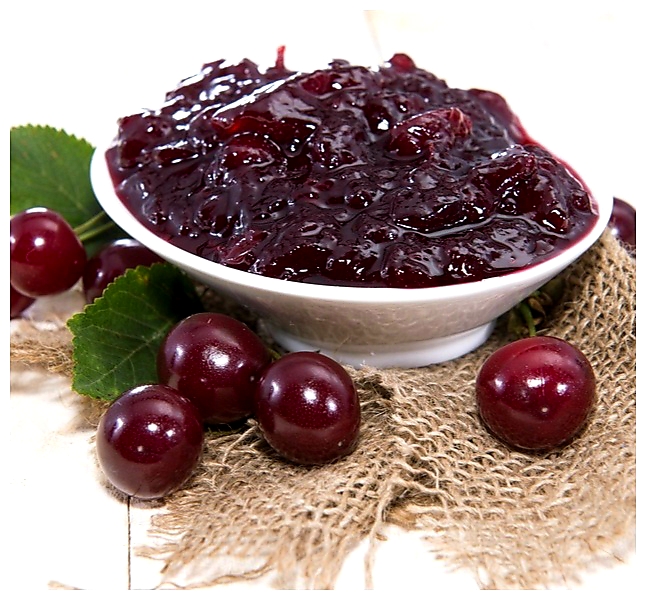 Fresh made Cherry Jam on wooden background
